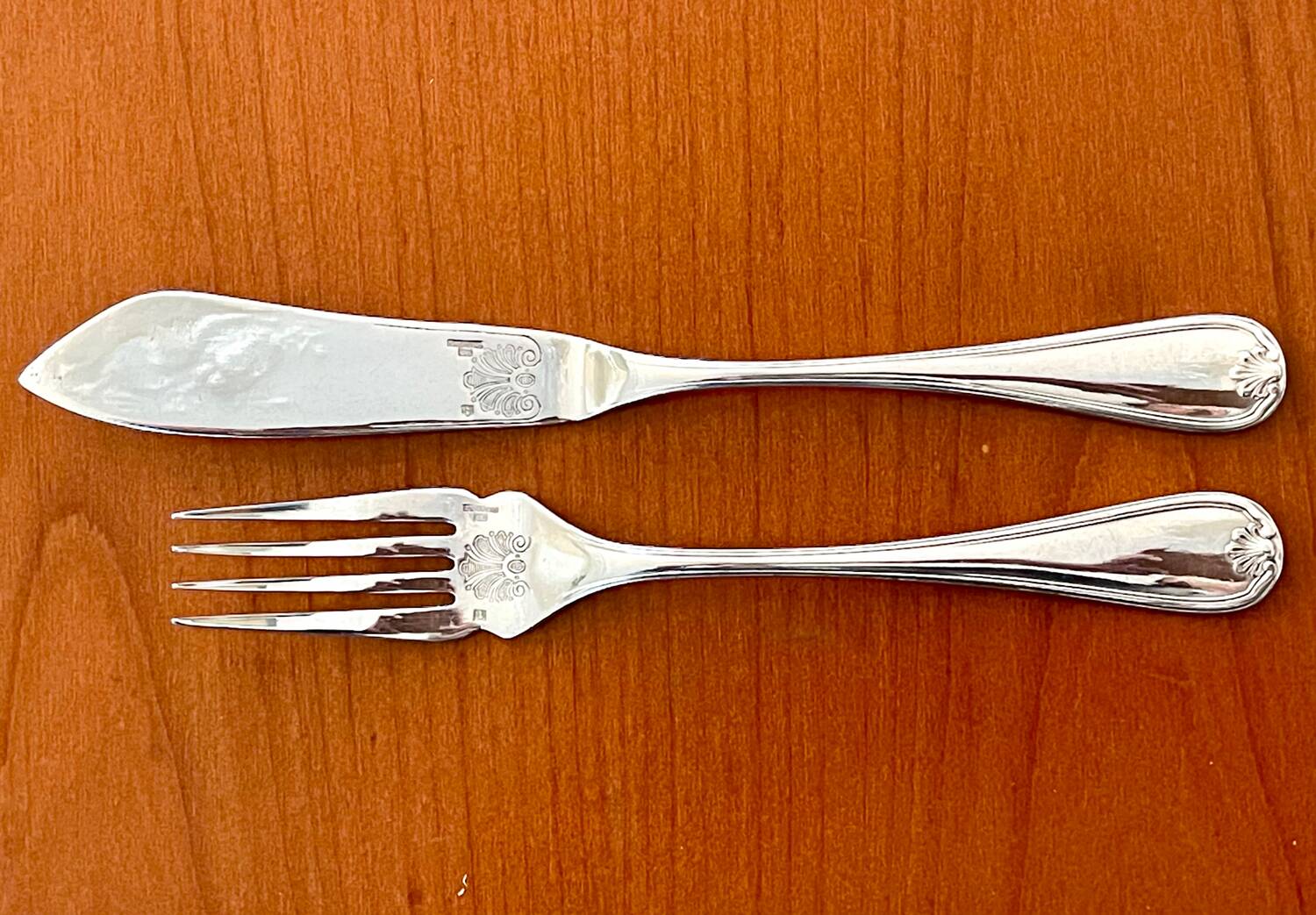 Christofle Marot Berain, 12 fish cutlery sets, shell decor