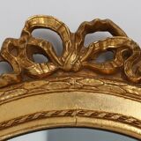 Oval shaped carved gilded Baroque mirror with beveled glass, Belgium