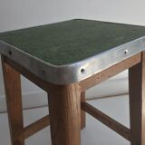 Wooden stool and green seat