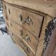 Stripped chest of drawers with bronze handles