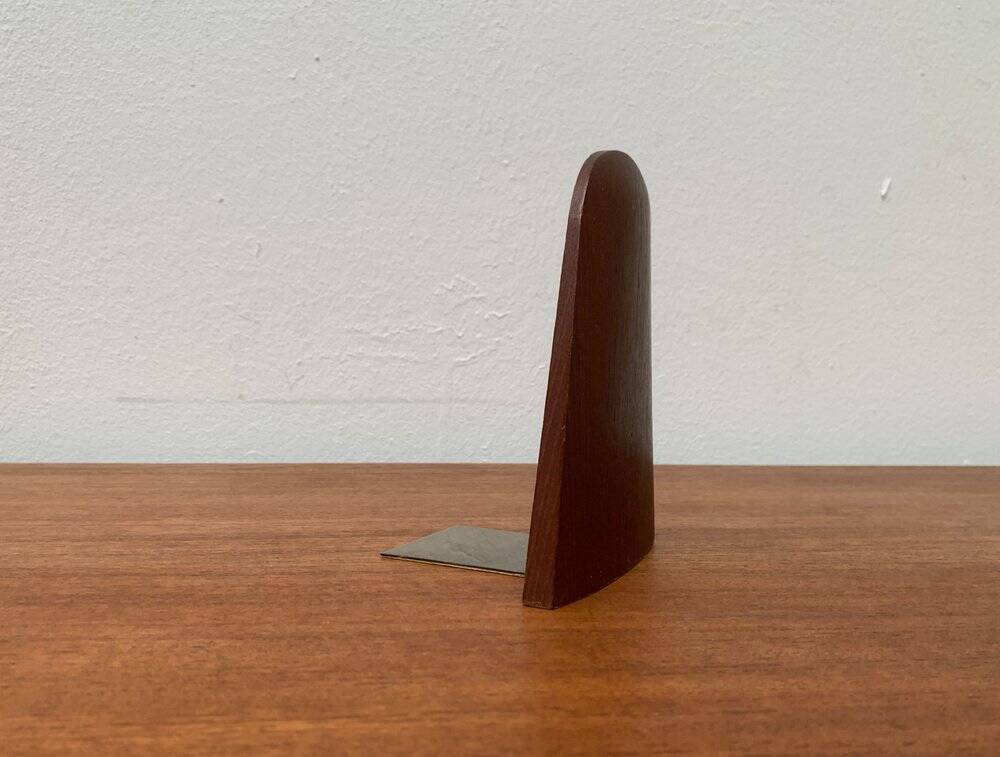 Mid-century Scandinavian bookends in teak and brass.