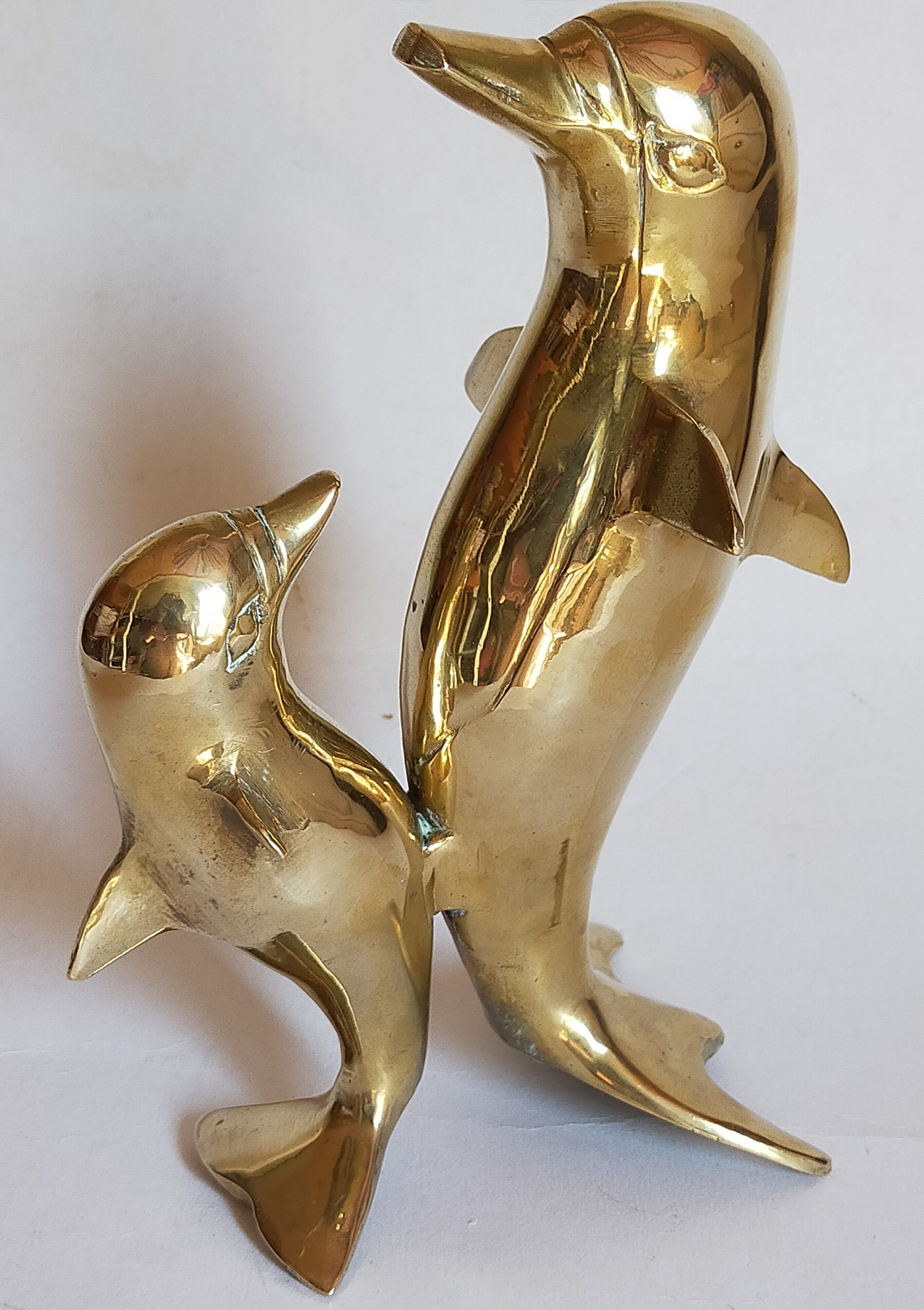 Vintage solid brass dolphins