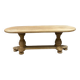 Massive oval monastery table in bleached oak with turned legs.