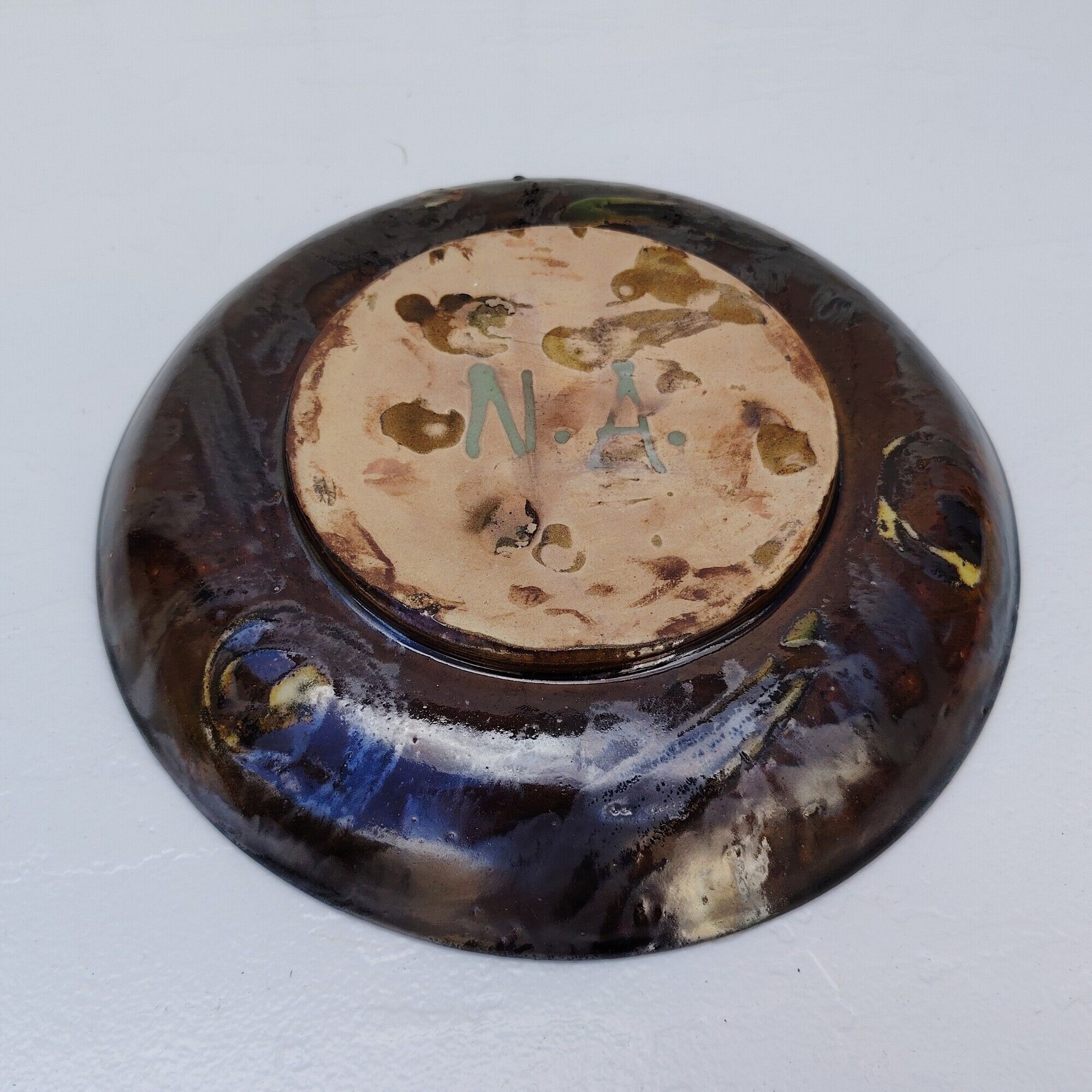 Decorative plate, glazed ceramic, floral design.