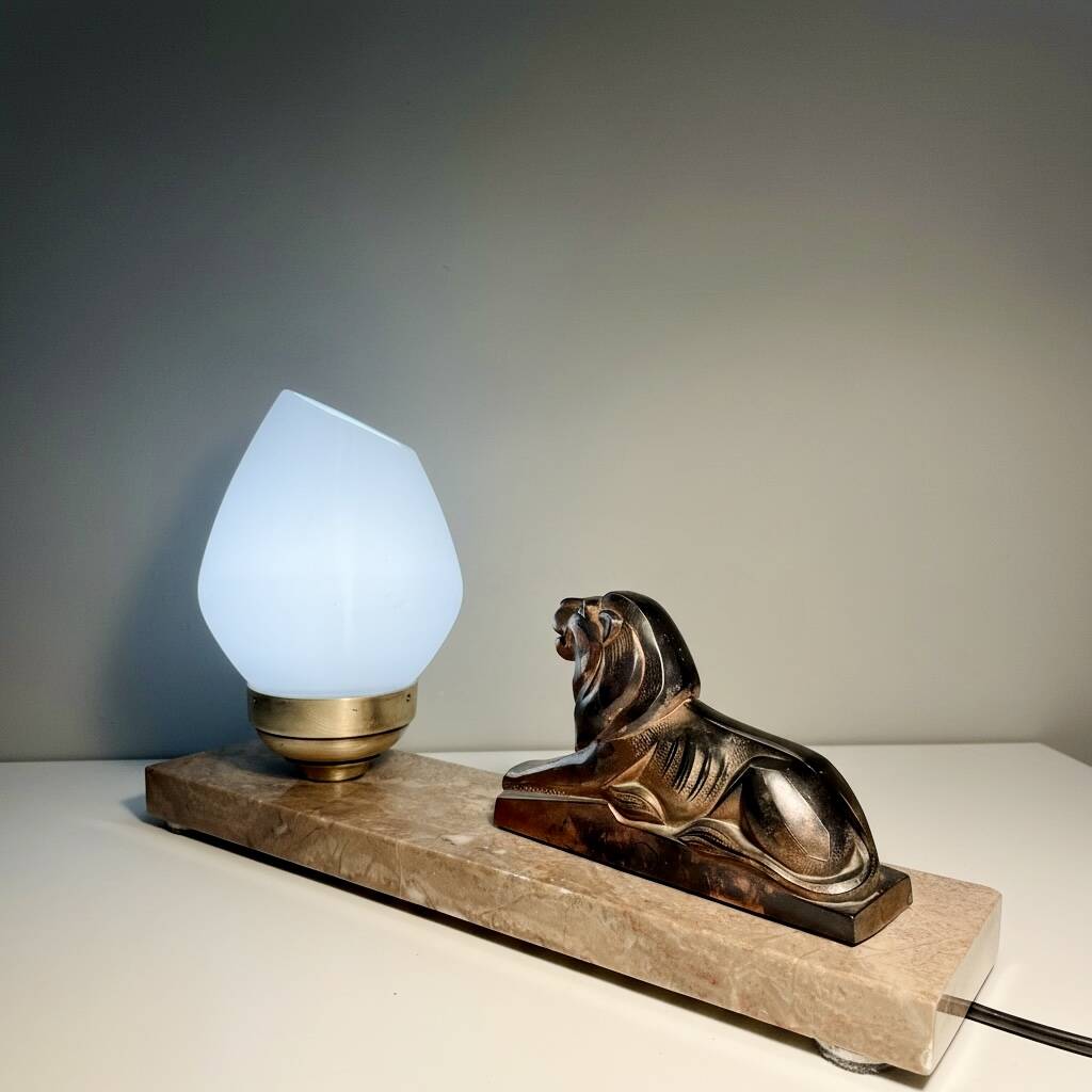 Art Deco lamp with marble, opaline globe & lion sculpture in spelter