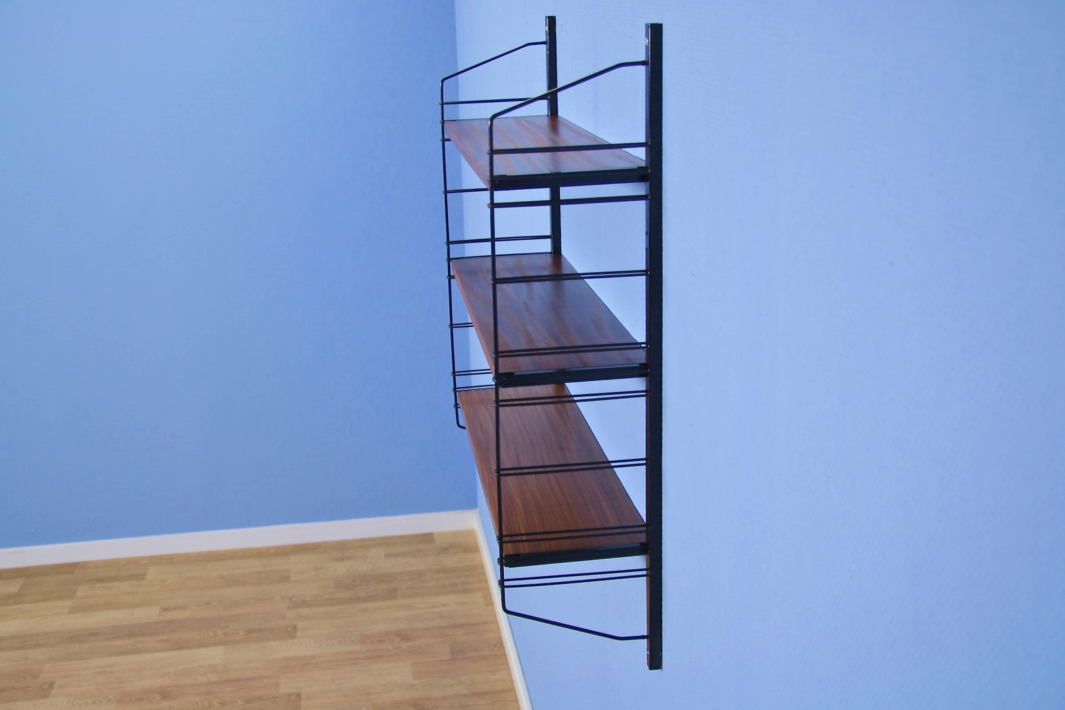 Dutch wall rack in teak and metal by A. Dekker for Tomado, 1960s