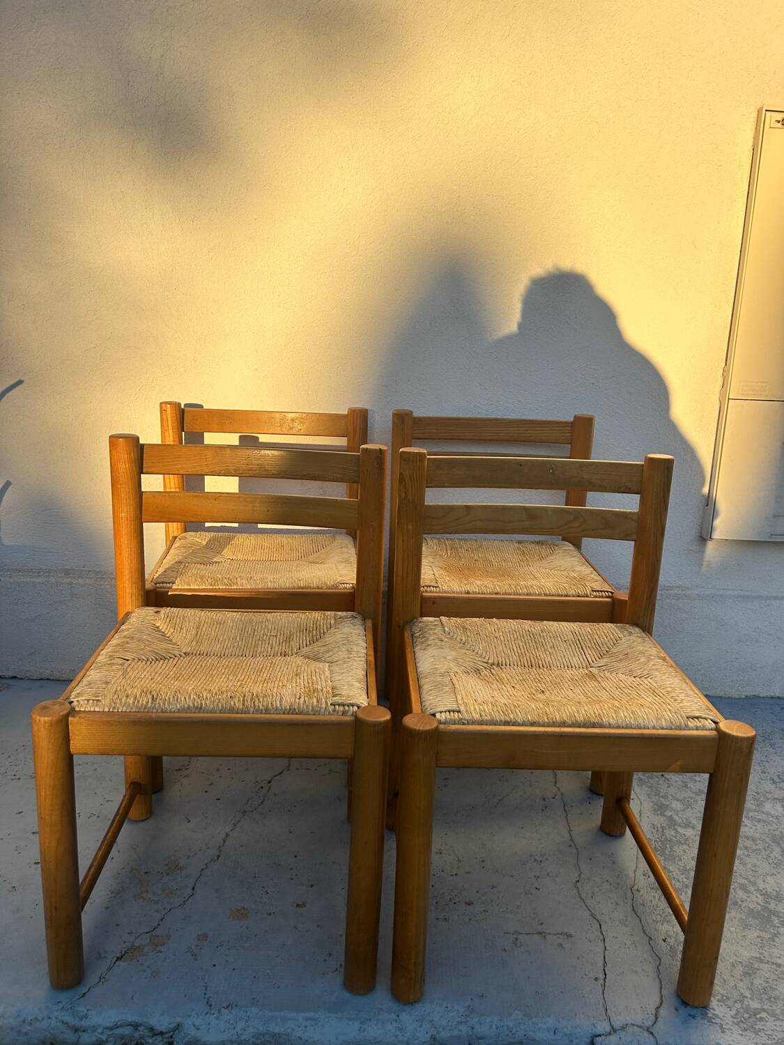 4 vintage chairs made of solid wood and woven straw