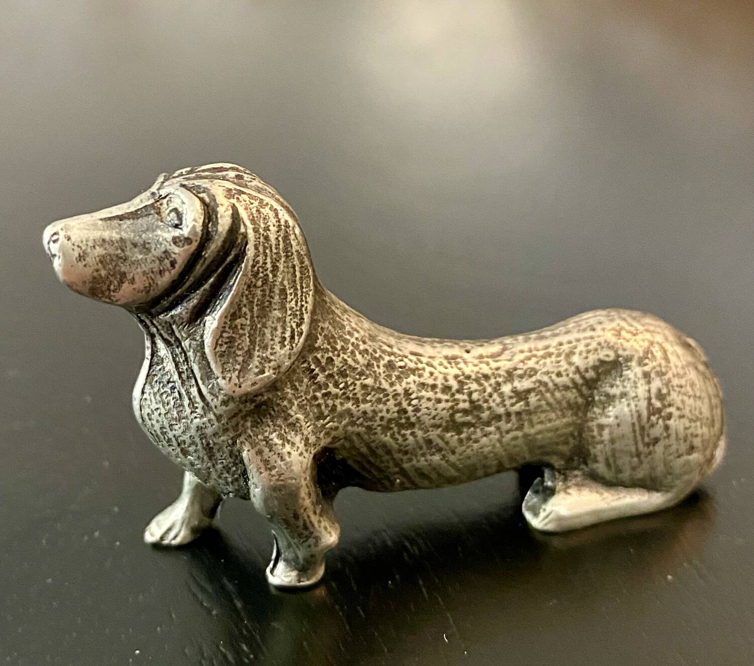 12 old dog-shaped Etains du Manoir knife holders