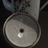 Enamelled sheet metal pourer decorated with black berries early twentieth century