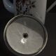 Enamelled sheet metal pourer decorated with black berries early twentieth century