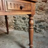 Antique French walnut table with six drawers, parquet top, early 20th century.