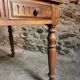 Antique French walnut table with six drawers, parquet top, early 20th century.