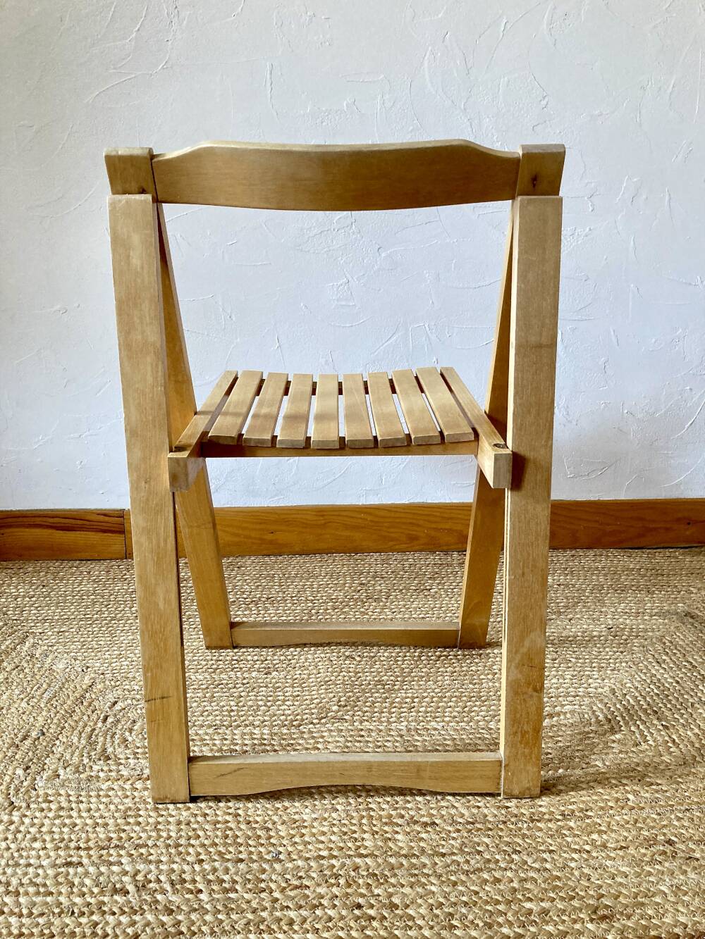 Folding chairs designed by Aldo Jacober in solid beech wood.
