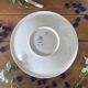 Large antique salad bowl on a Gien earthenware pedestal