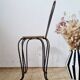 Small chair / stool in twisted wrought iron and floral ceramic.