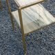 Pair of neoclassical side tables in bronze, brass, marble, and o.