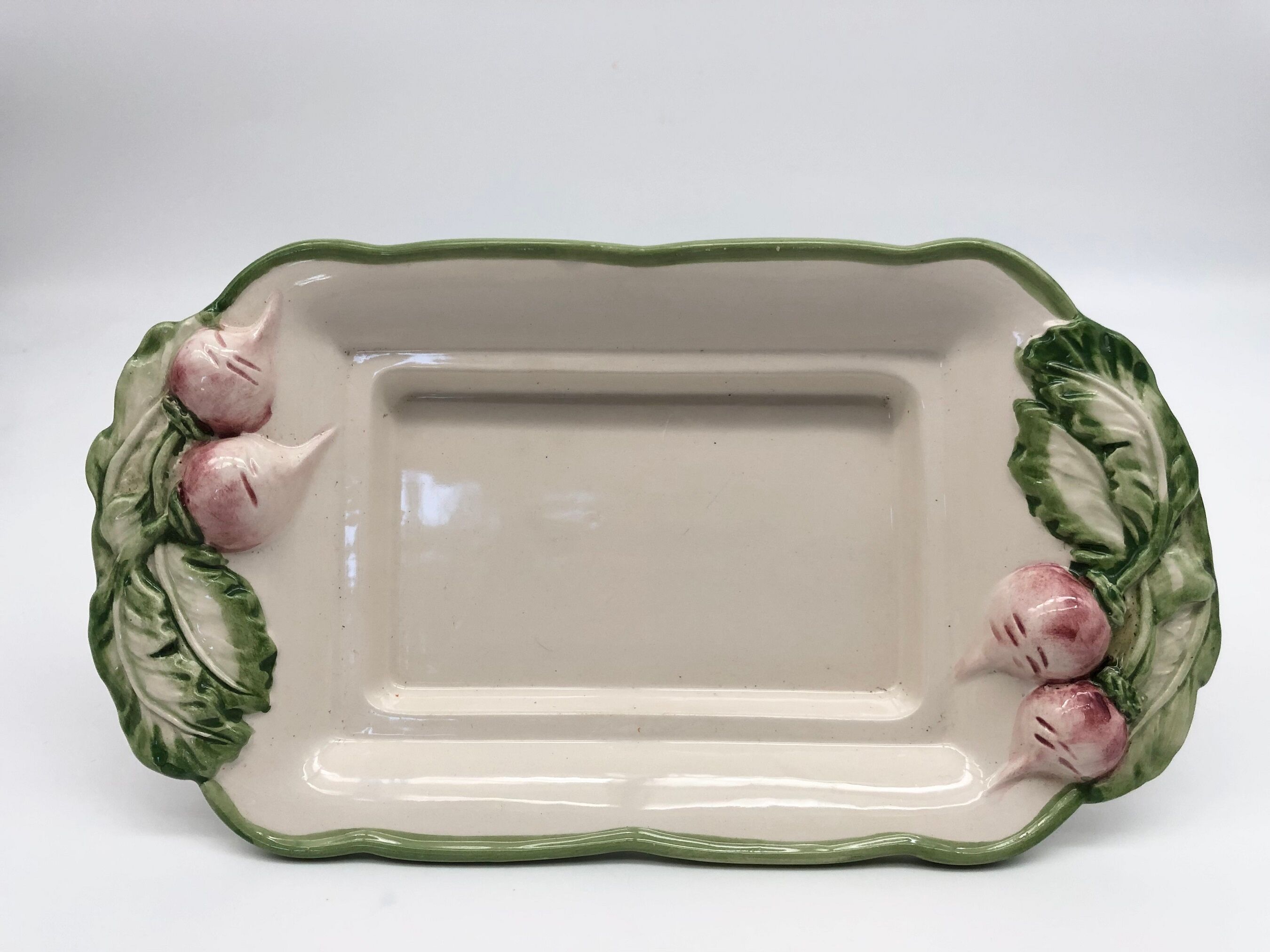 Slurry butter dish, with radish drawings. Signed "FG"
