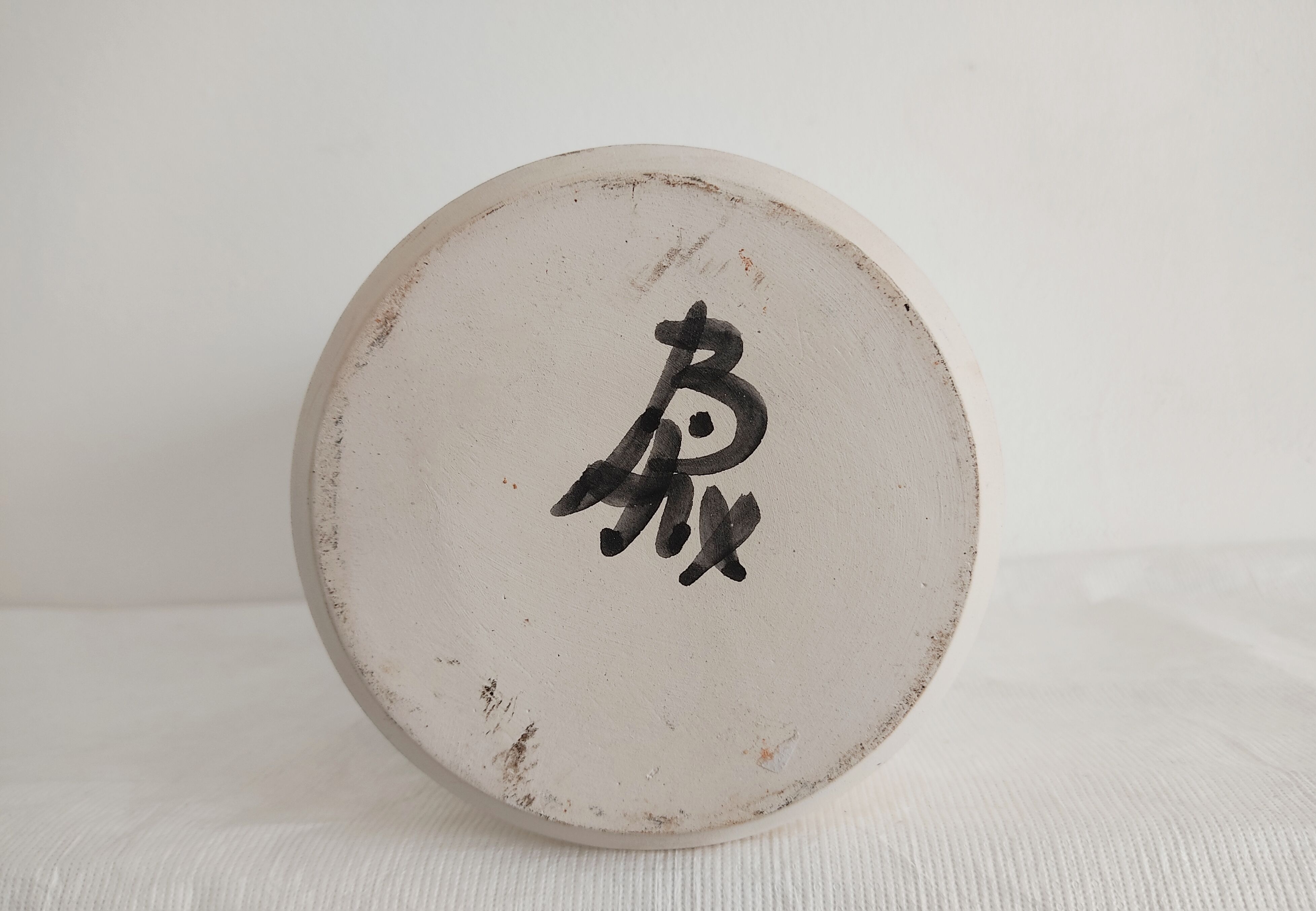 Vase decorated in hollows of bottles and glasses