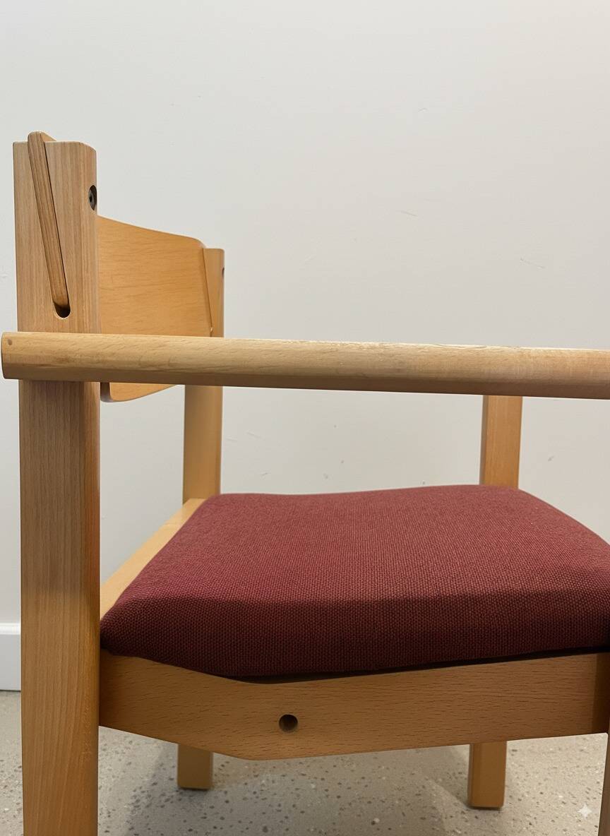 Scandinavian style oak and burgundy chair with armrests