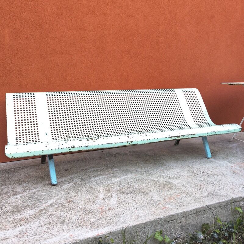 Public bench made of perforated iron