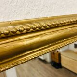Antique gilded mirror in old Louis Philippe wood