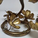Pair of brass candle holders decorated with patinated metal flowers