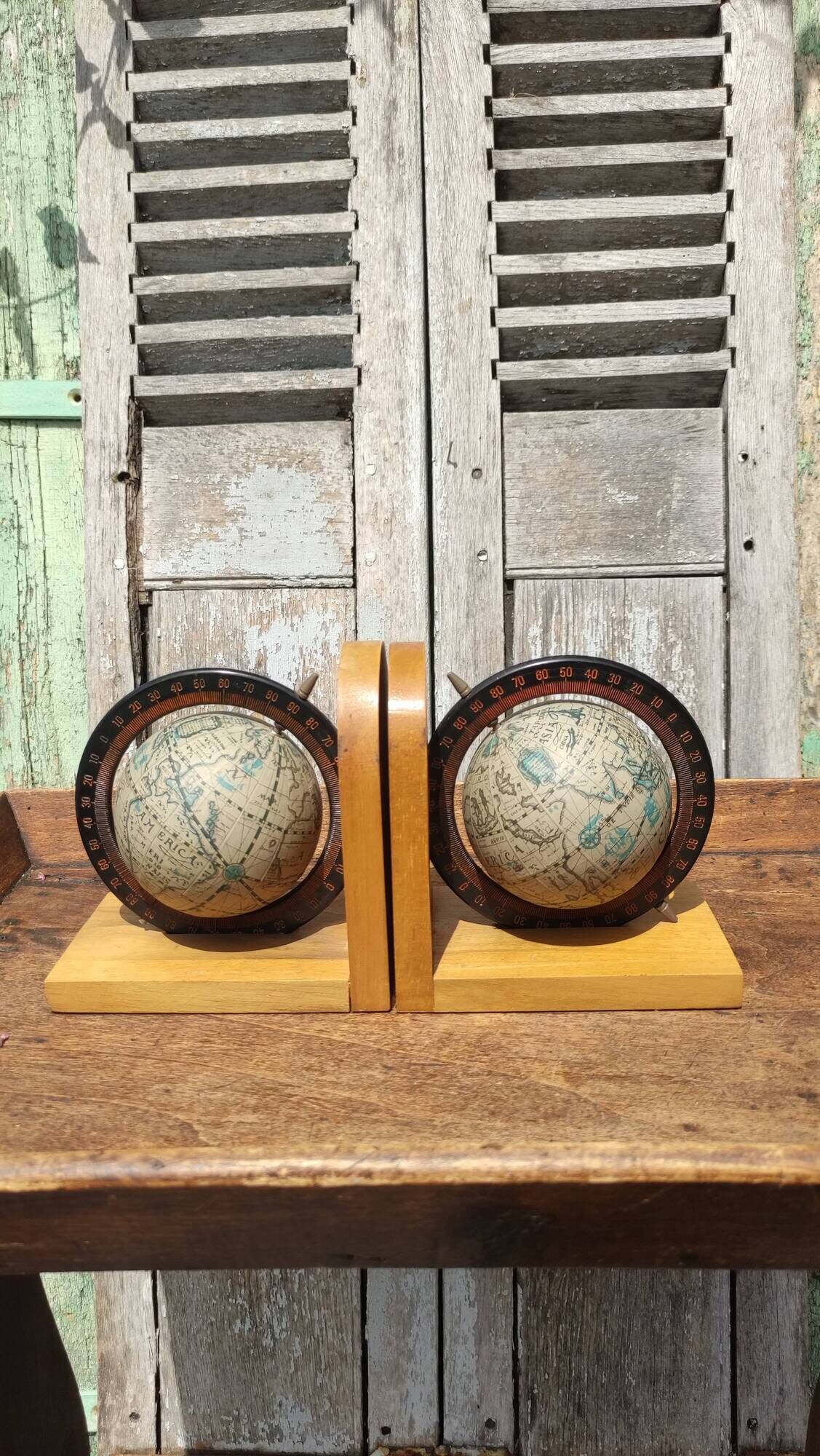 Pair of greenhouses vintage wooden books world map