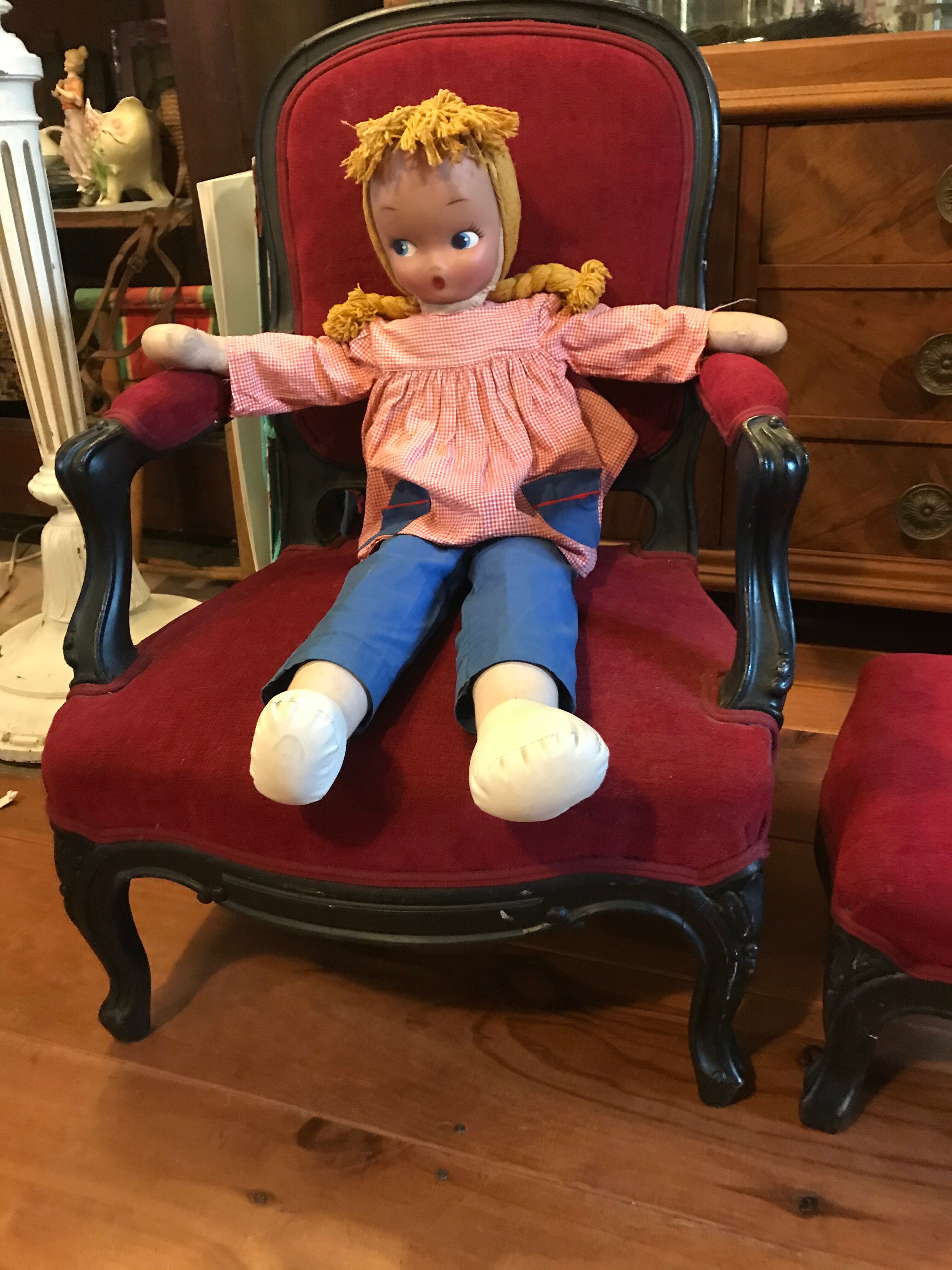 Old children's armchair with foot rests