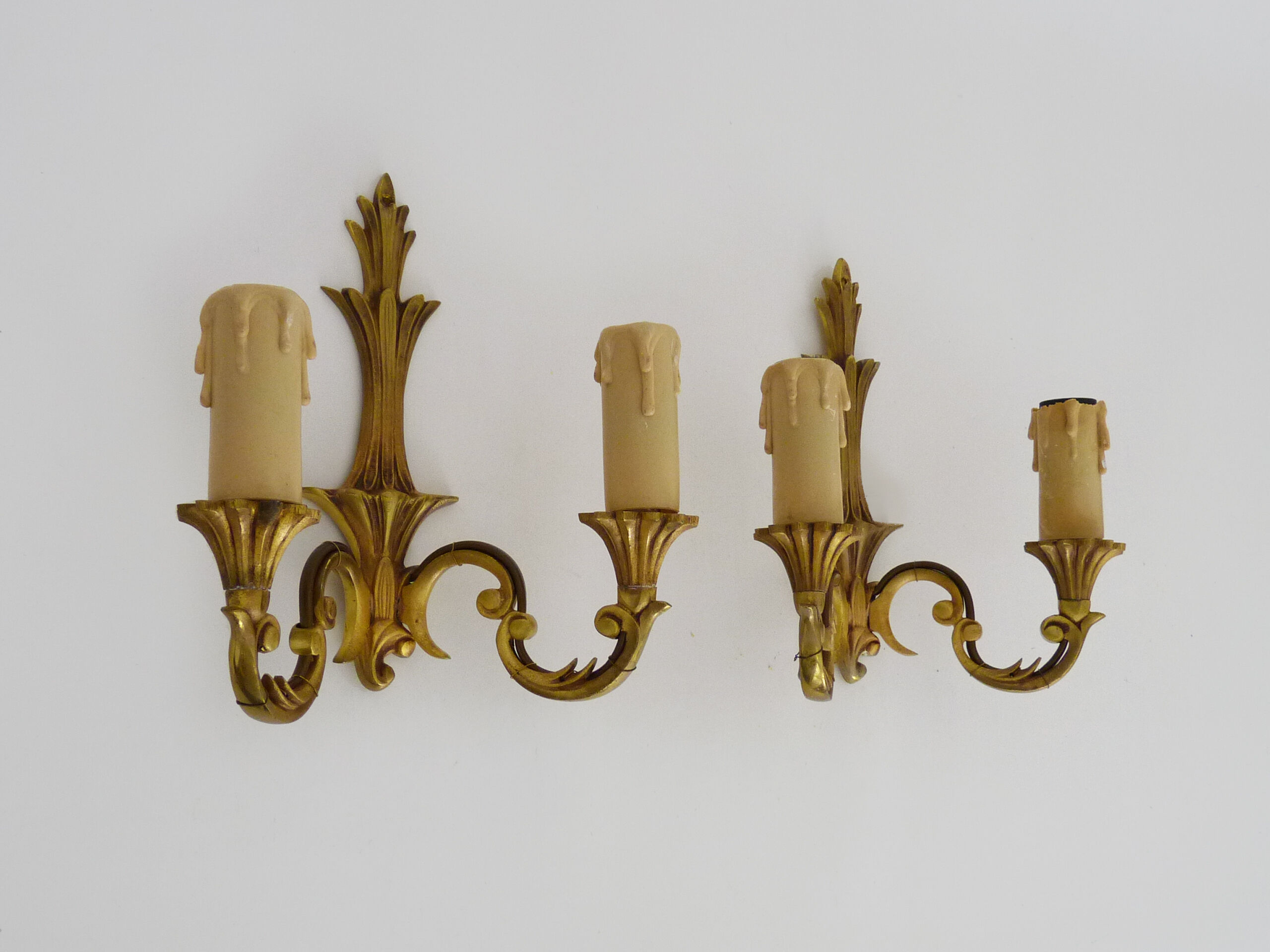 Old pair of wall sconces with double fires in bronze, seventies