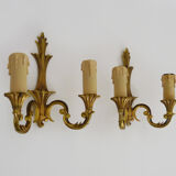 Old pair of wall sconces with double fires in bronze, seventies