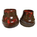Pair of red vases in the shape of an elephant's foot