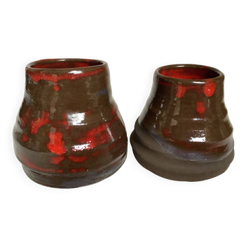 Pair of red vases in the shape of an elephant's foot