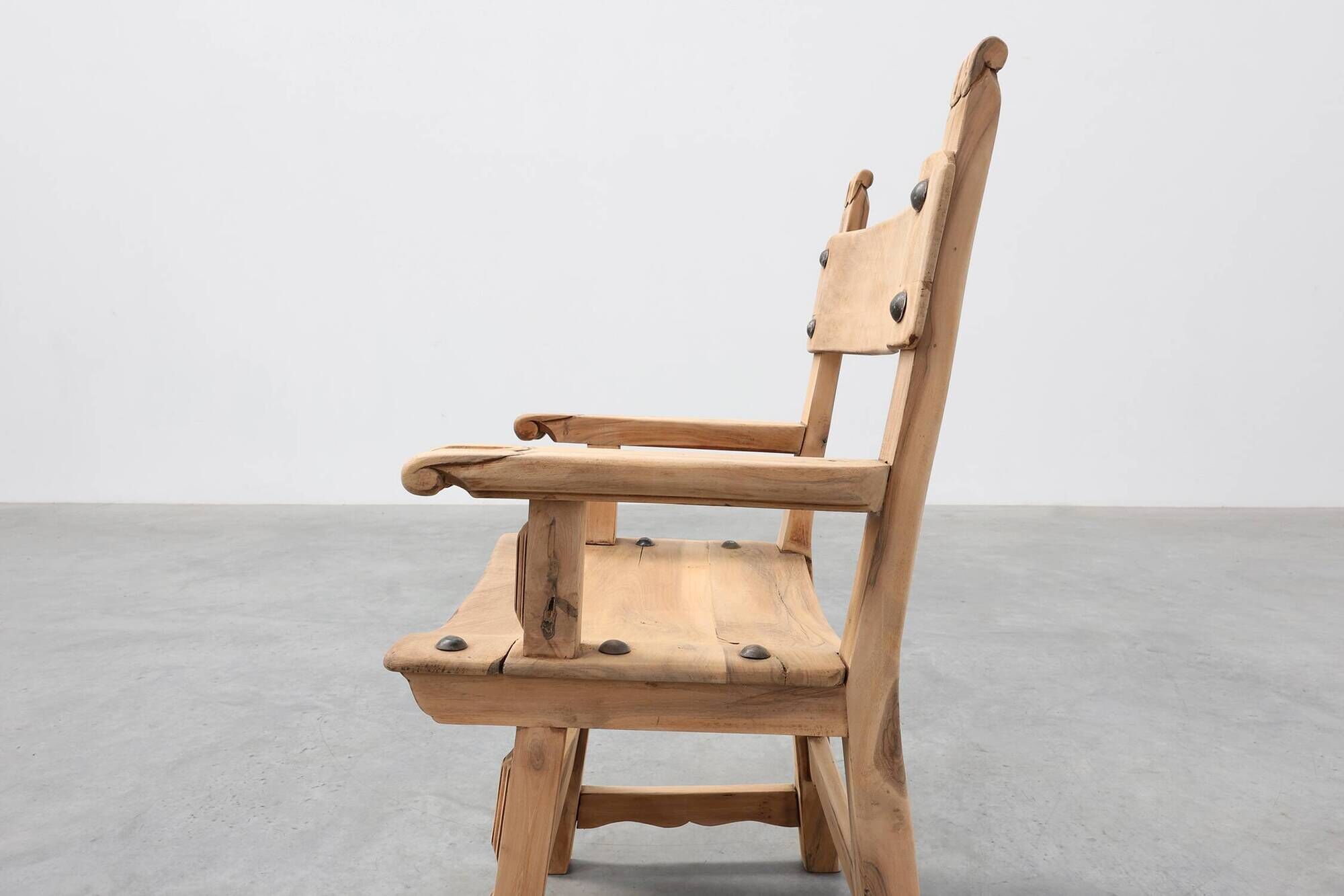 Brutalist armchair with carved rosettes and nailed wooden seat, Spain, 20th