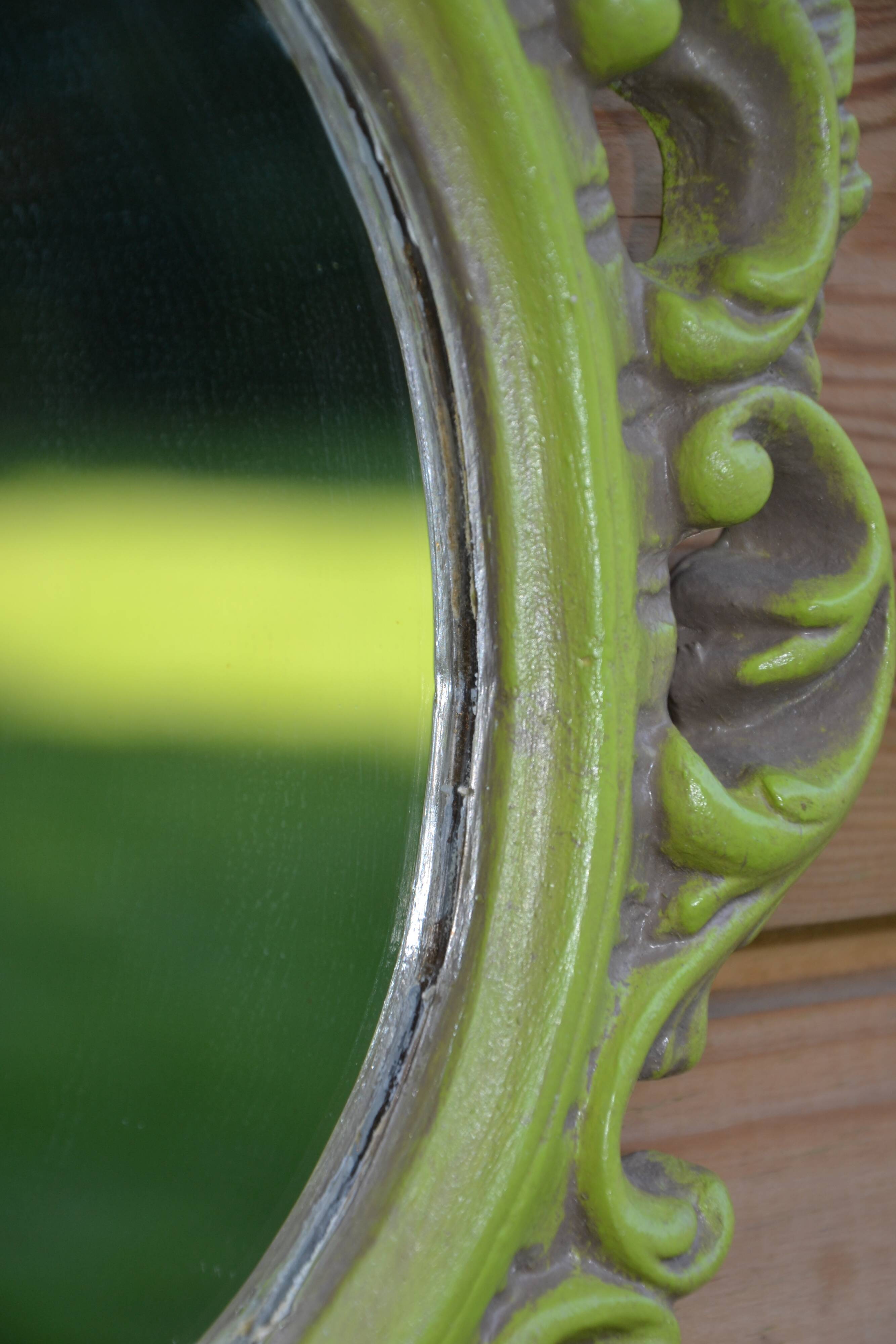 Small green wooden mirror