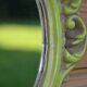 Small green wooden mirror