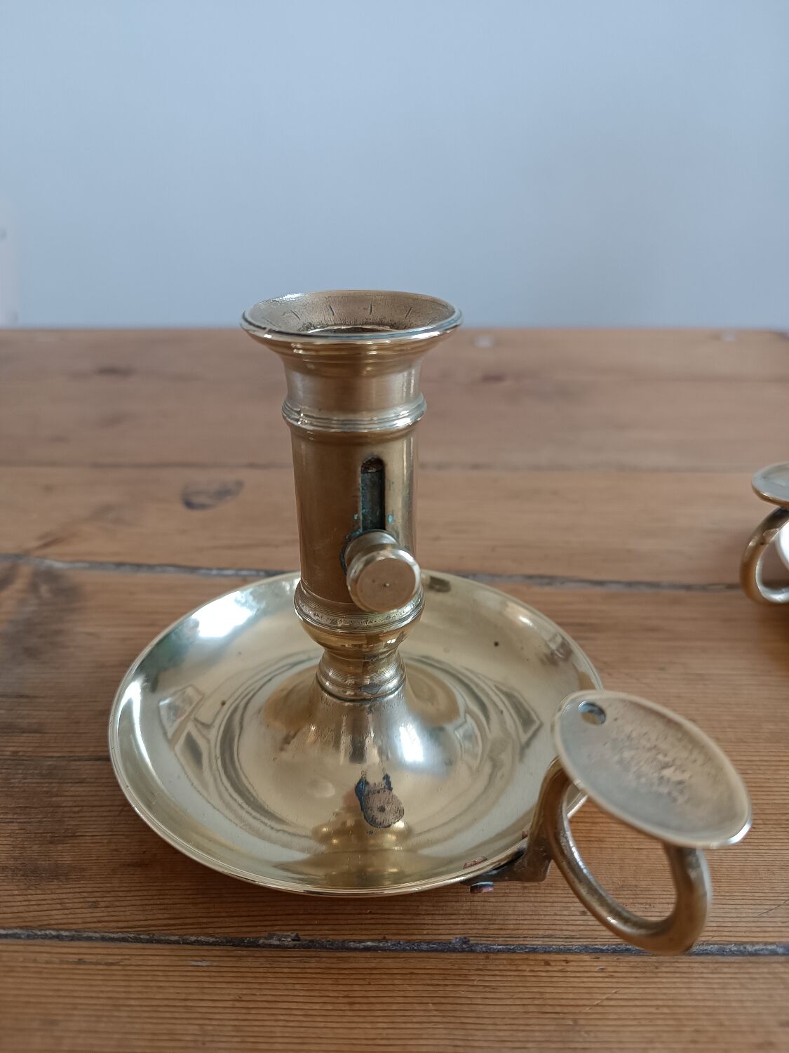 Duo of gilded brass cellar rat candlesticks