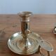 Duo of gilded brass cellar rat candlesticks