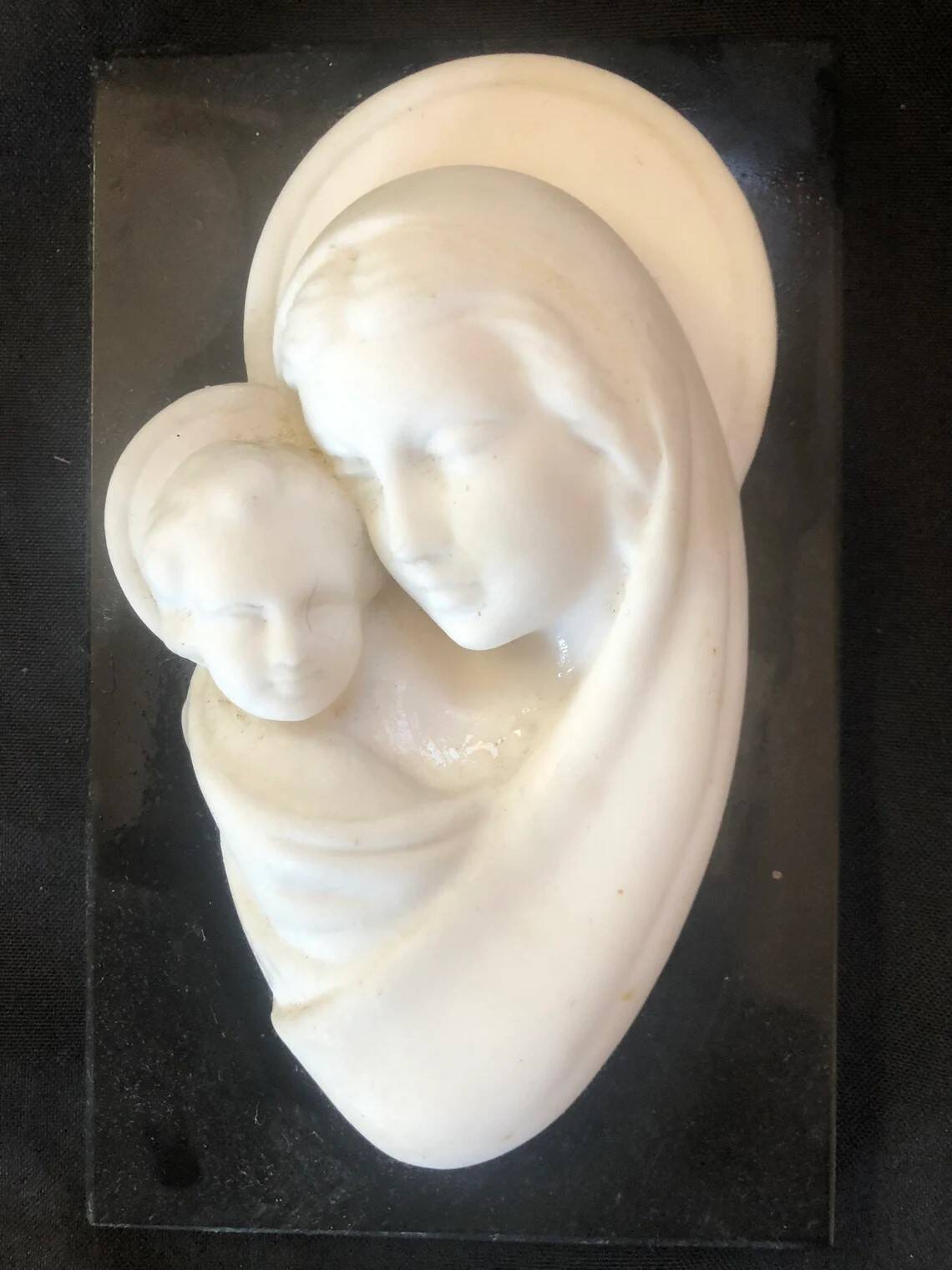 Virgin and Child bas relief in alabaster on black marble Inactive Photos