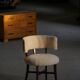 A modern Danish elegant low-back chair, reupholstered in lambswool, 1940s.