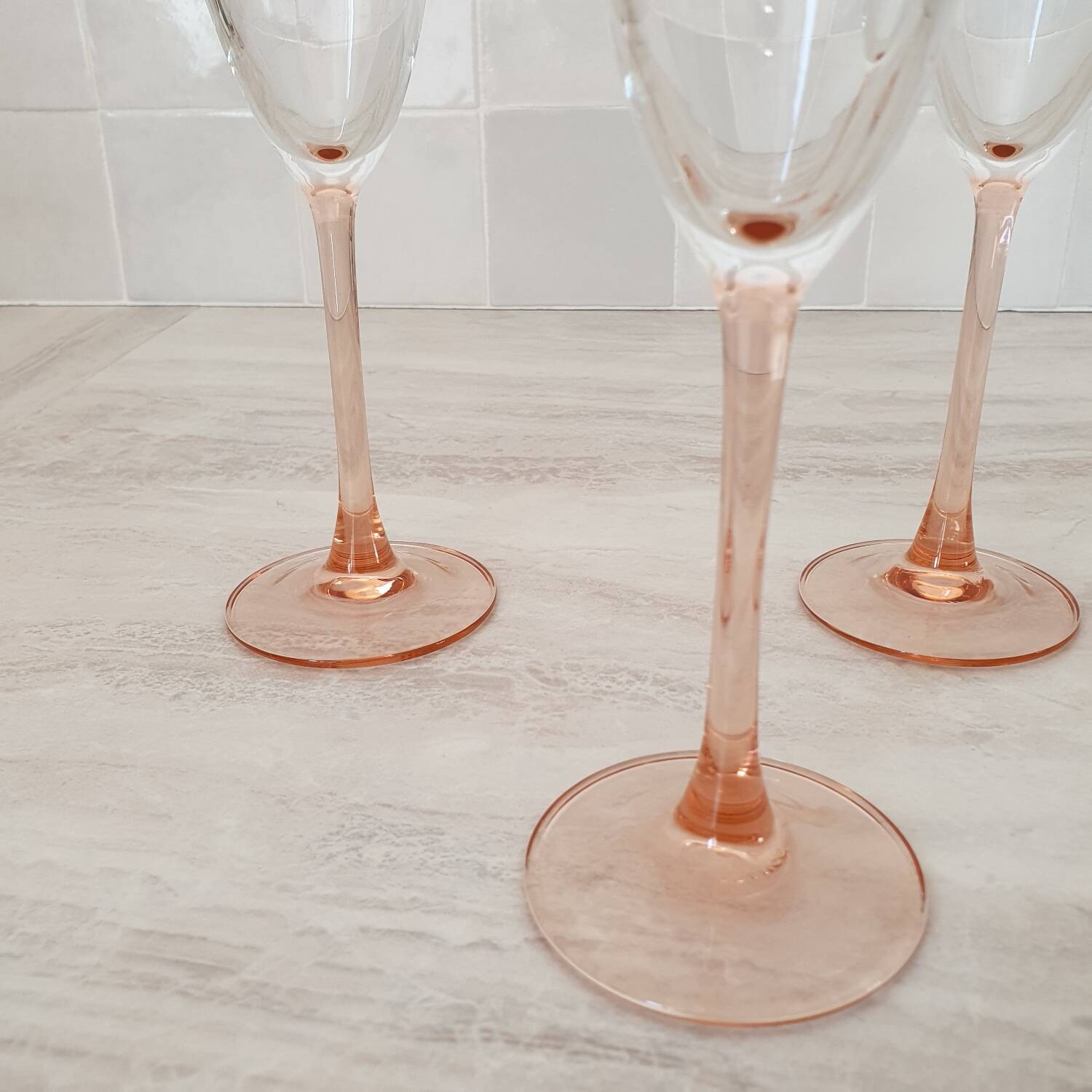 6 champagne flutes with pink stems