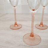 6 champagne flutes with pink stems