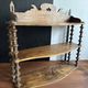 Antique wall shelf made of turned wood and spools of thread, late 19th century.