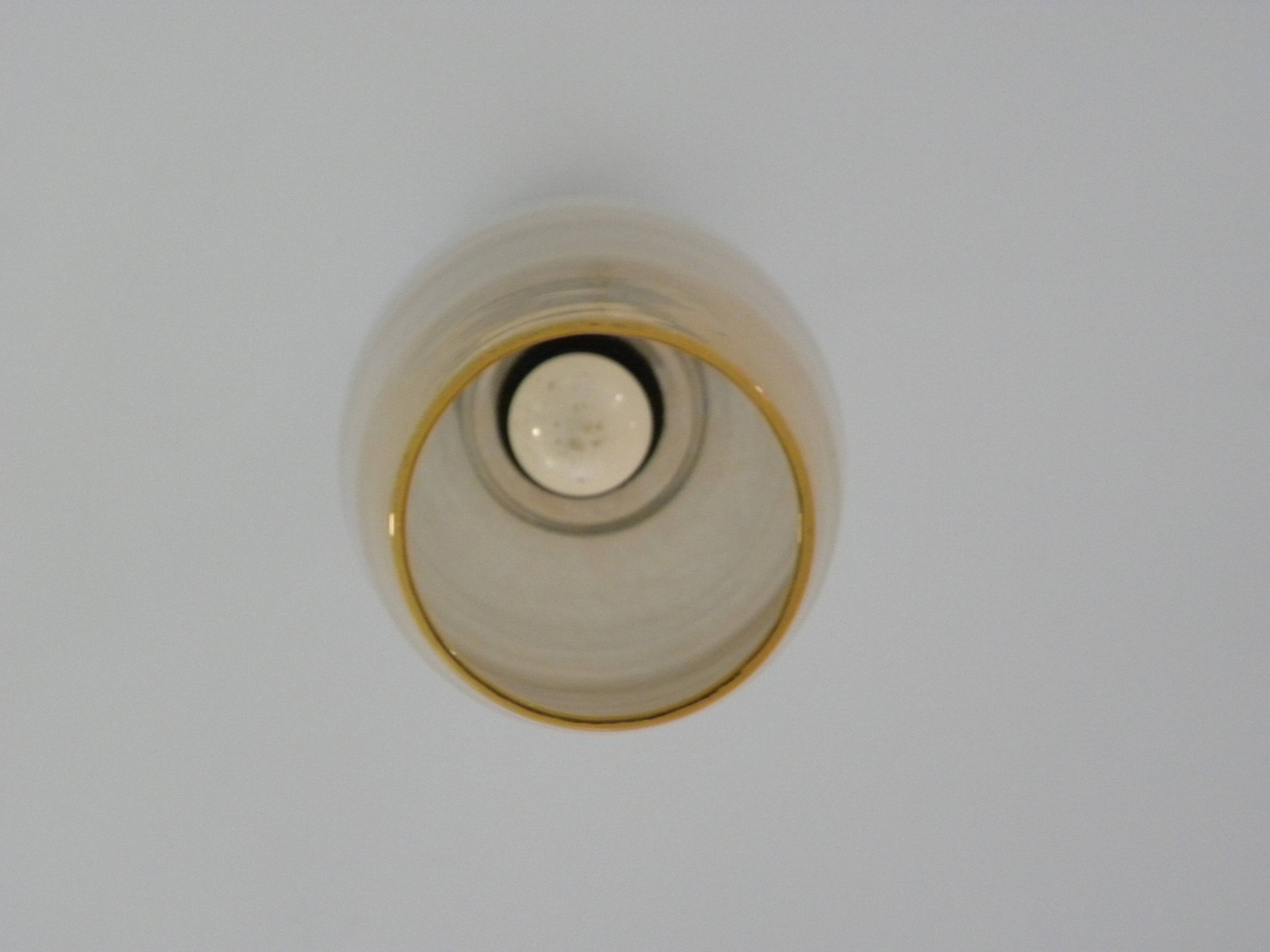 Amber glass suspension light, warm modern interior lighting.
