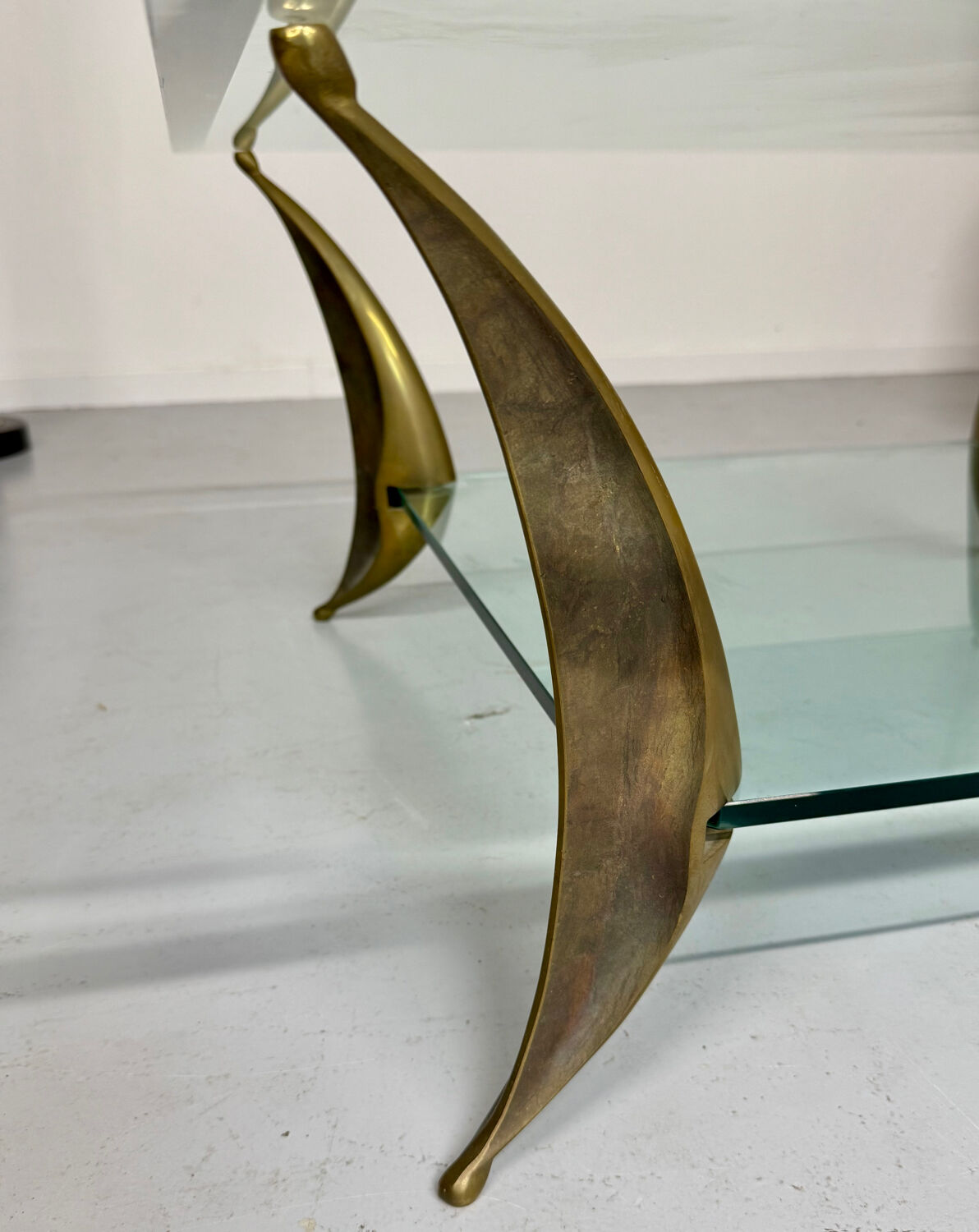Glass coffee table with solid brass legs, Italian design from the 60s