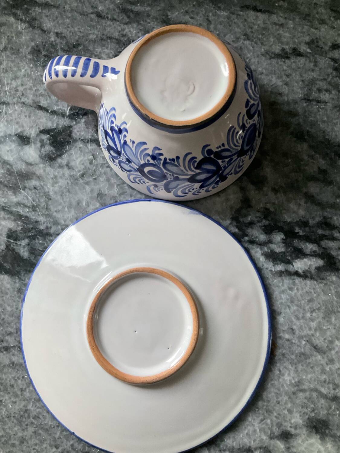 Set of 4 white/blue ceramic cups and saucers.