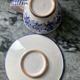 Set of 4 white/blue ceramic cups and saucers.
