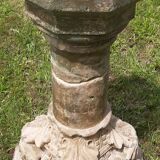 Holy water font on stone column (17th century)
