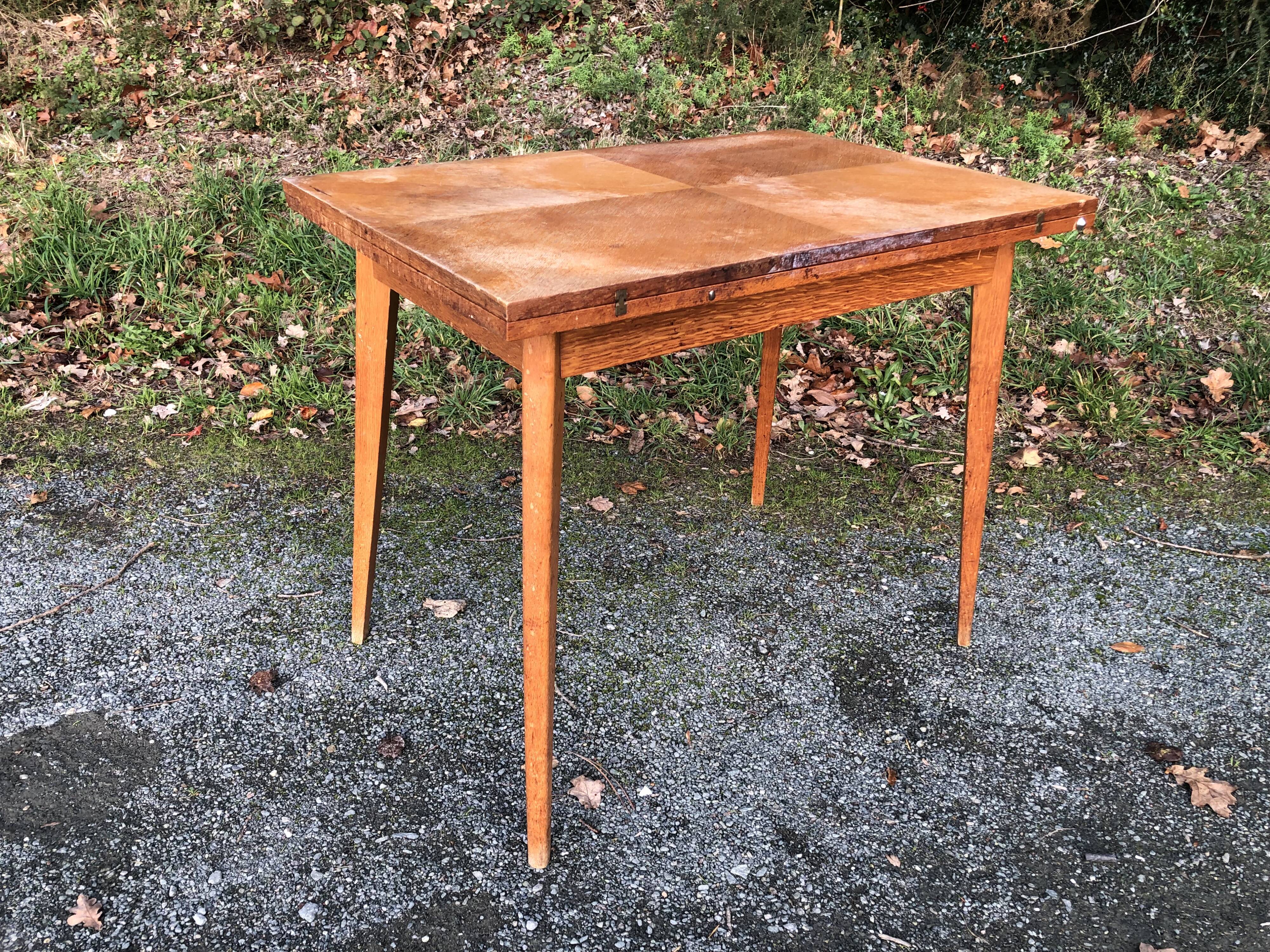 Vintage so-called portfolio table with oak compass base and its oak cp swivel top.