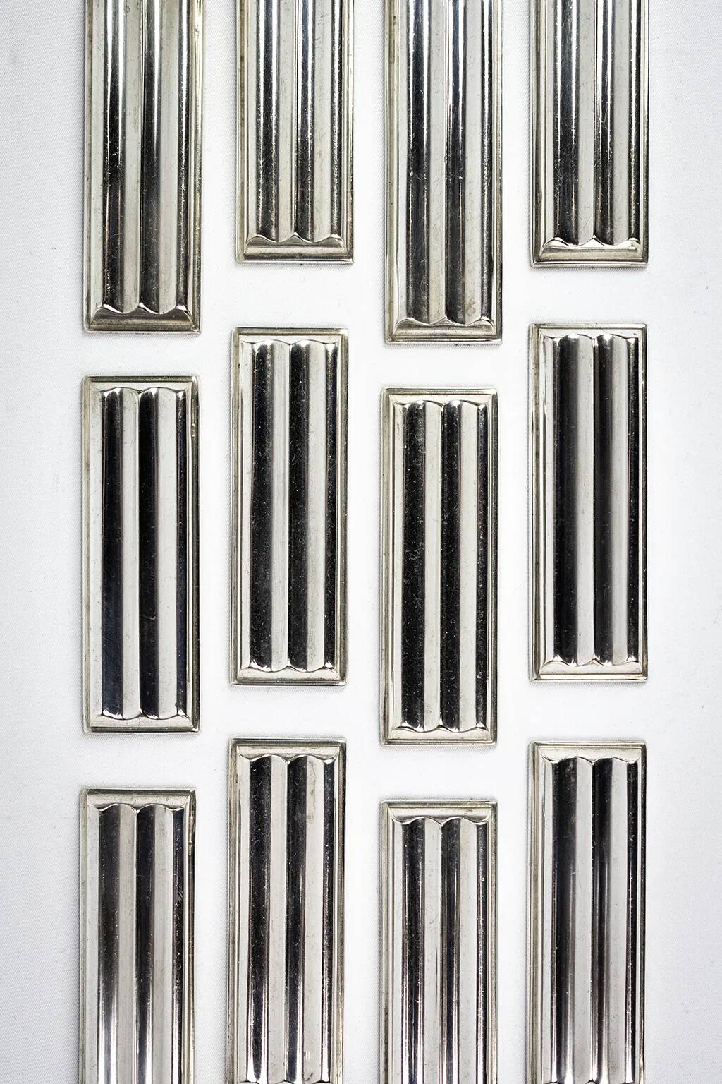 Christofle — 12 “Ondulations” knife rests by Luc Lanel, silver-plated metal