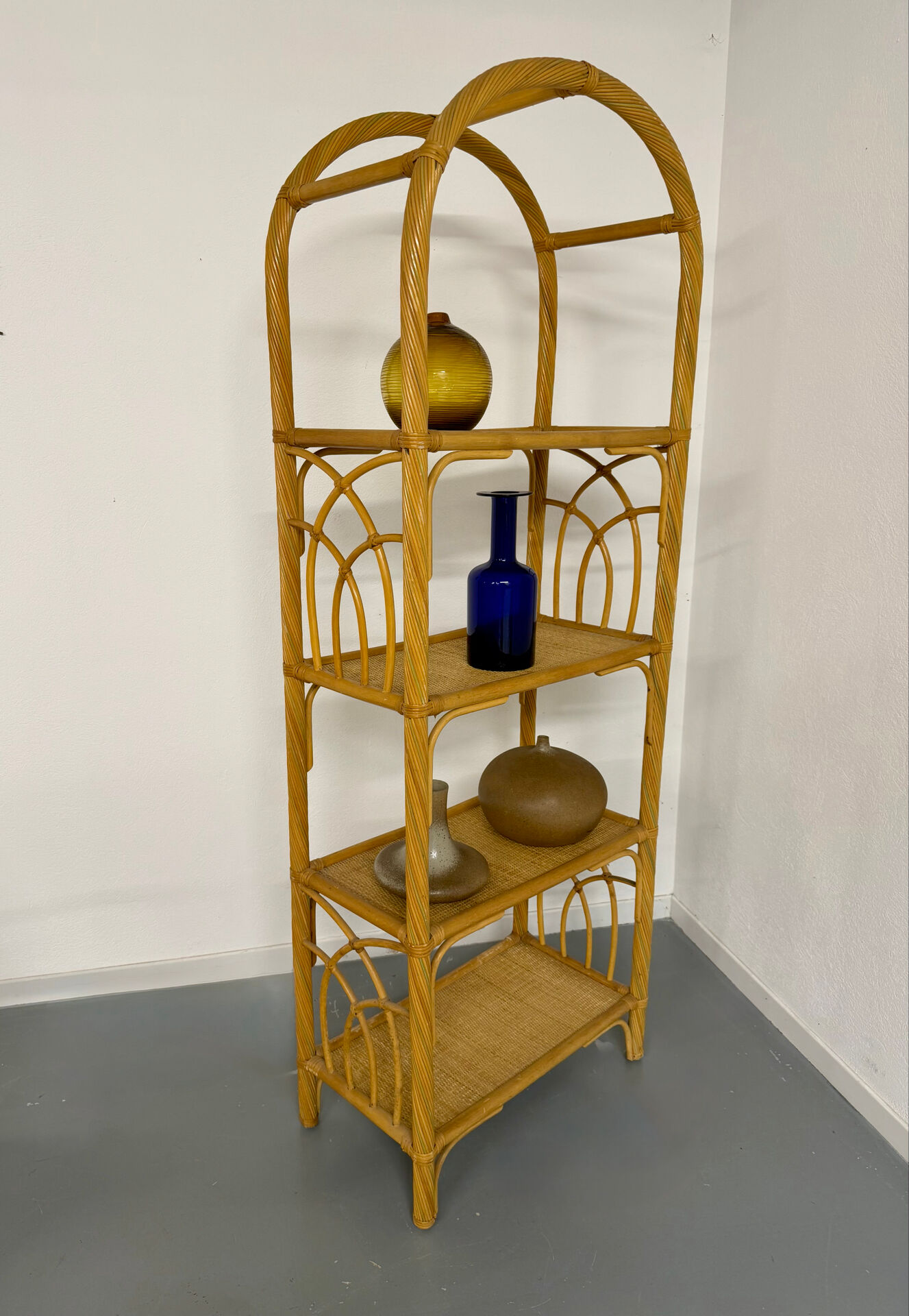 Large woven rattan bookshelf designed in the 1970s.